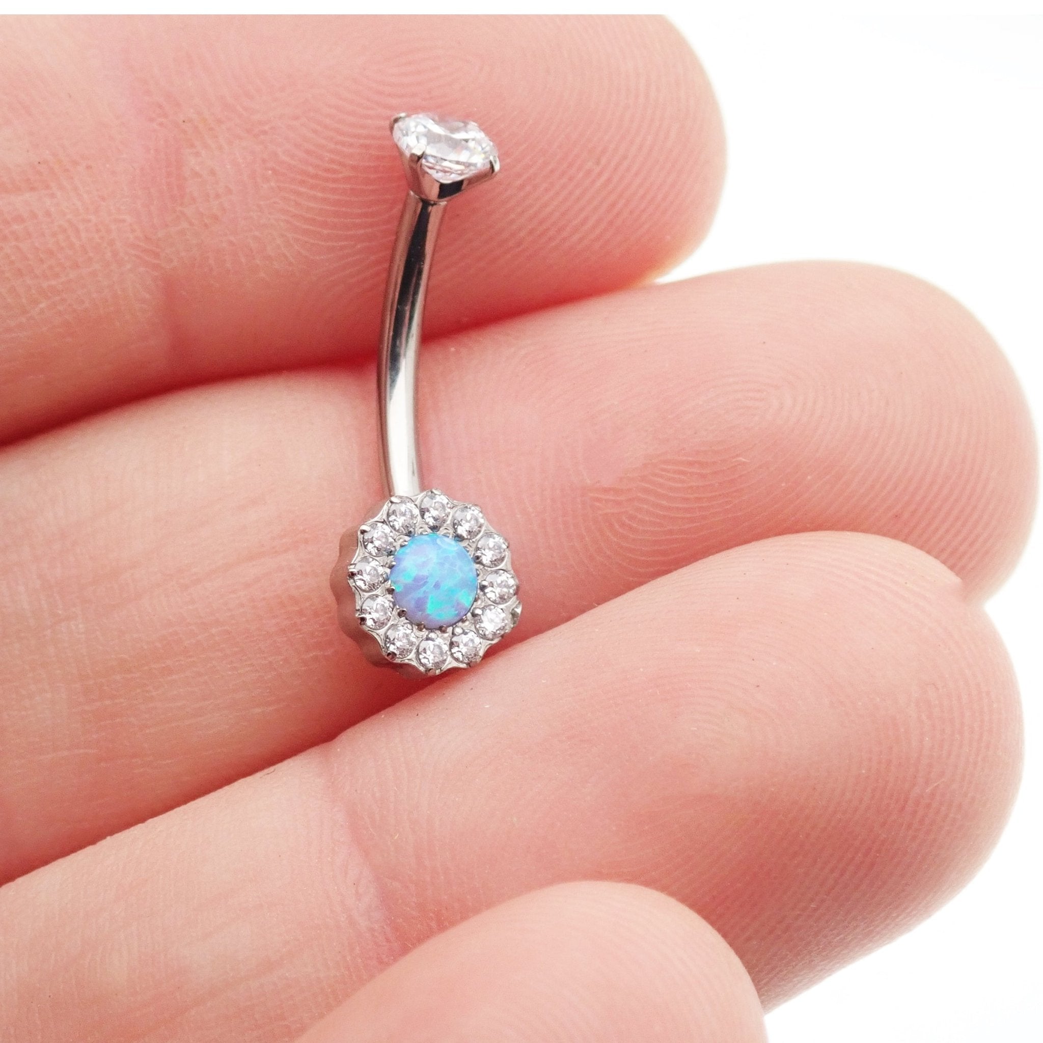 Clear CZ and Azure Blue Opal 10mm titanium belly ring with 14g gauge, featuring a sleek design and secure clasp.