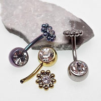 Beaded CZ flower and ball belly bar in 14g body jewelry by Body Clickers with decorative beads and floral design.