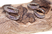 Titanium hinged hoop earrings by Body Clickers, 10mm body jewelry with secure hinged design, suitable for various piercings.