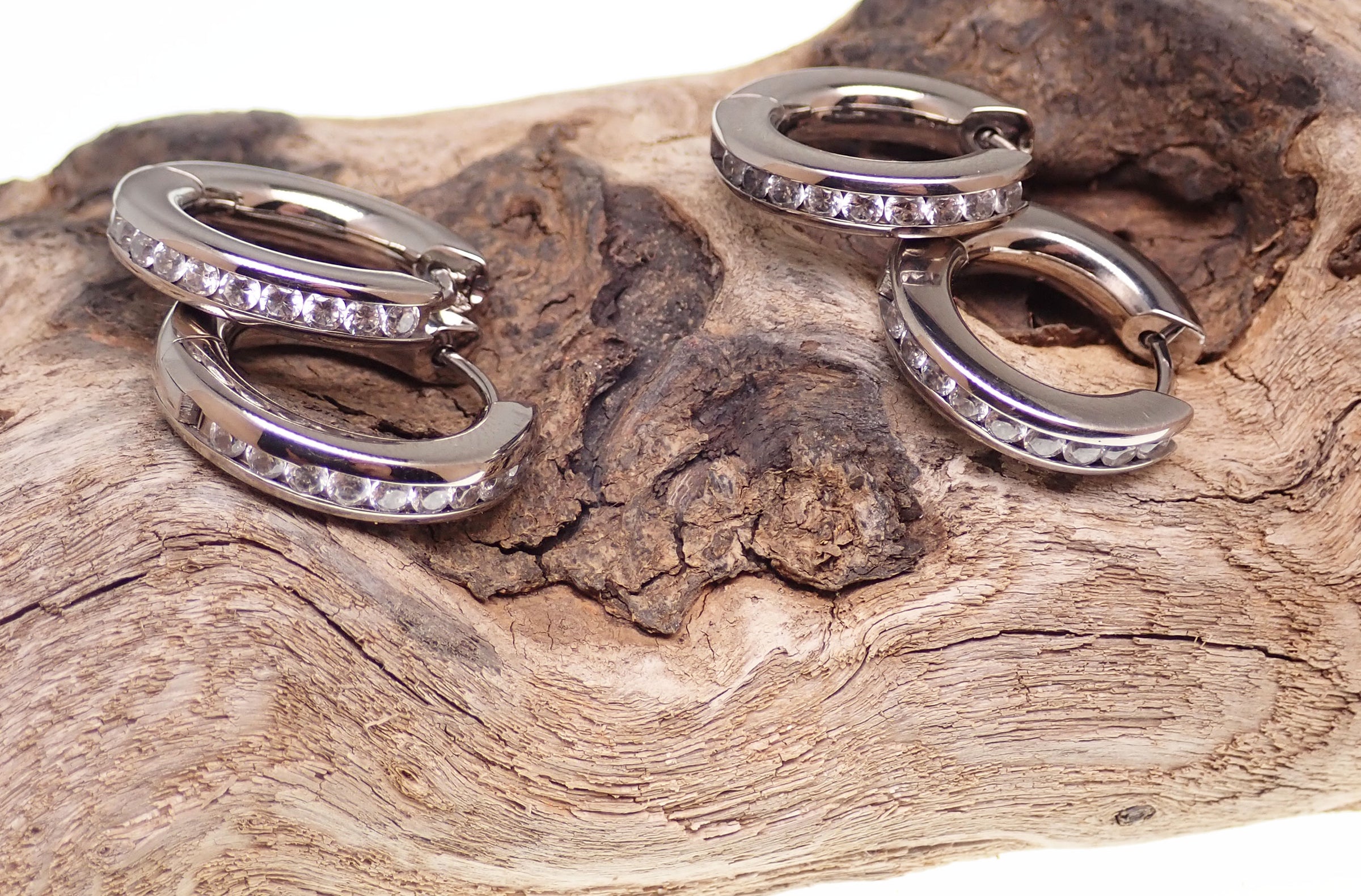 Titanium hinged hoop earrings by Body Clickers, 10mm body jewelry with secure hinged design, suitable for various piercings.