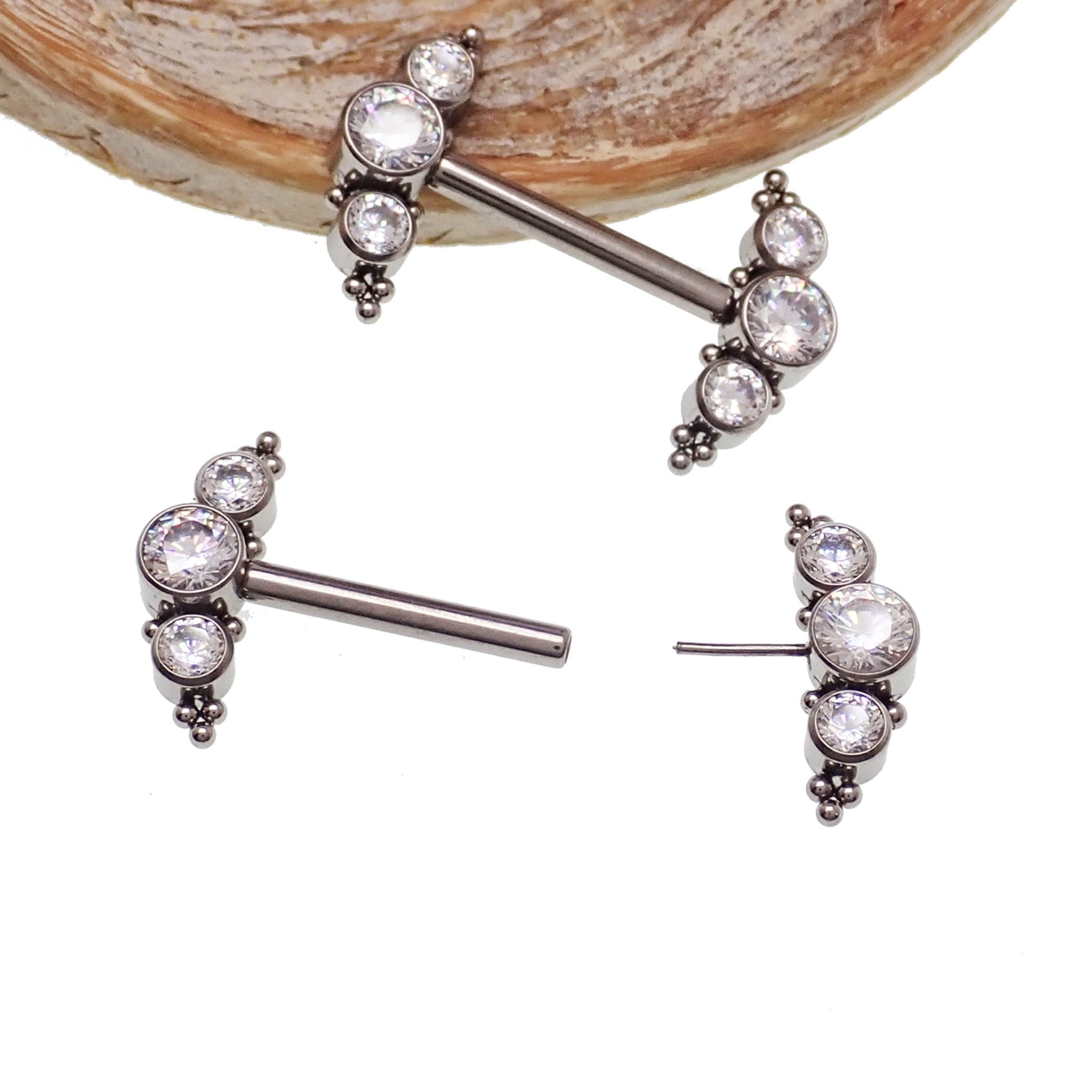 Clear CZ push fit nipple bar in 14g body jewelry by Body Clickers, featuring a sleek, transparent design with sparkling cubic zirconia accents.