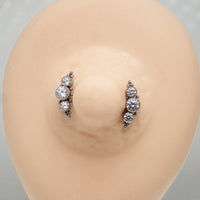 Clear cubic zirconia push fit nipple bar in 14g body jewelry by Body Clickers, shown in close-up view.