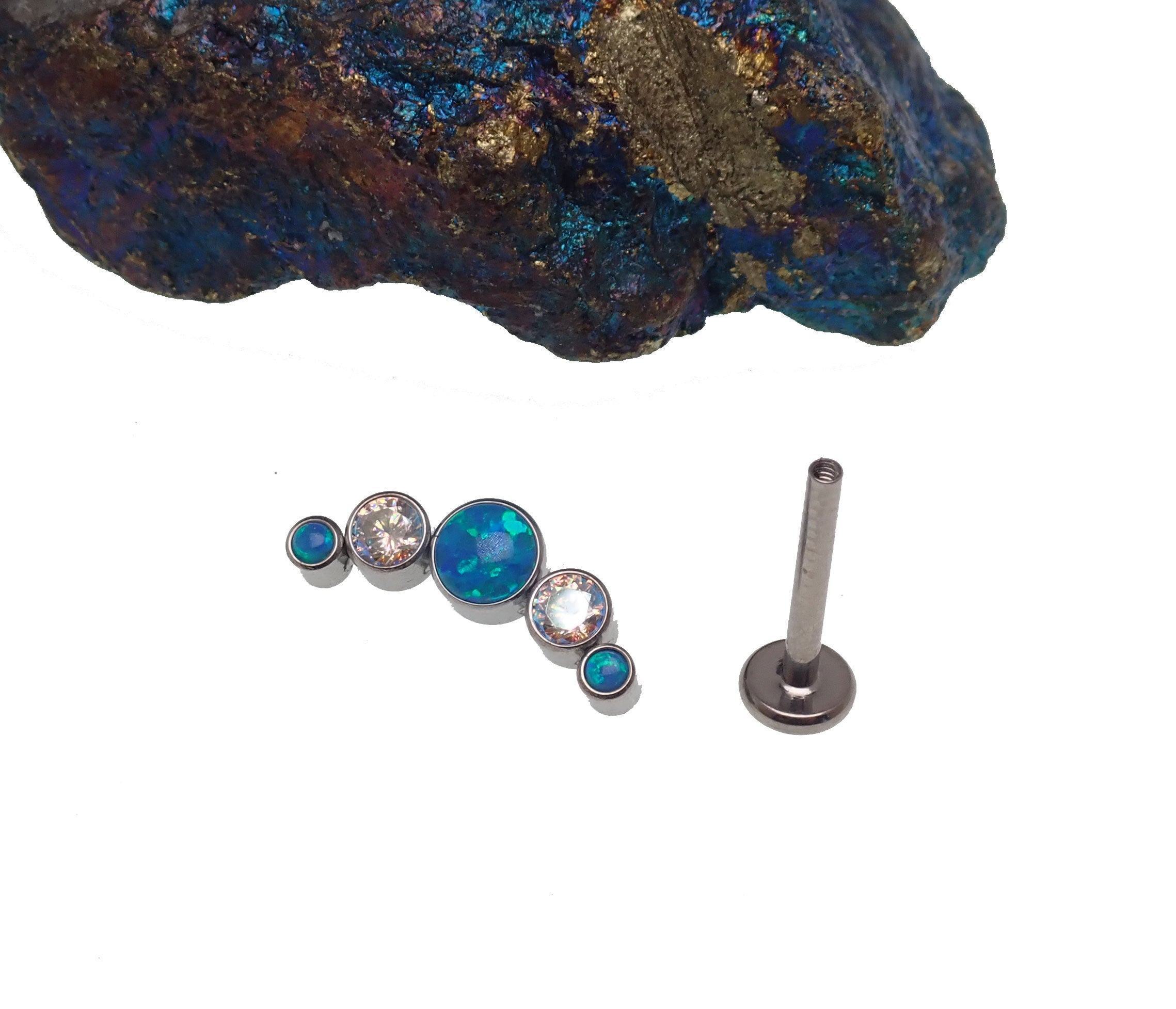 Blue opal and rainbow CZ helix cluster body jewelry in 14g, 16g, or 18g sizes featuring a spiral design by Body Clickers.