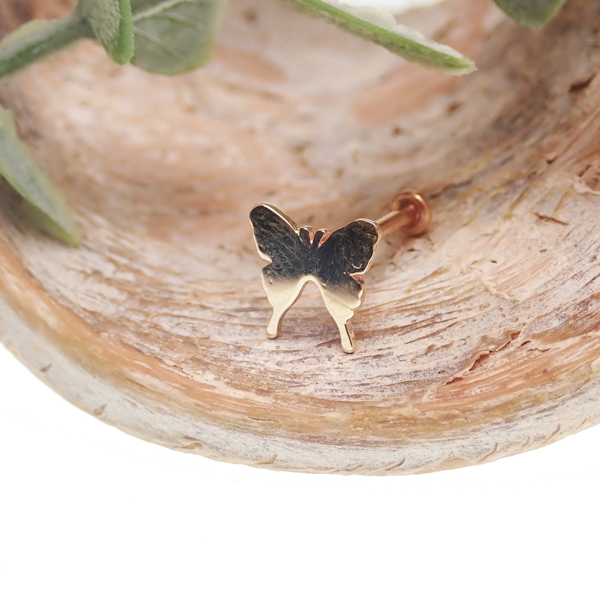 Butterfly 14k gold flat back body jewelry in 14g, 16g, 18g, or 20g sizes, featuring a delicate butterfly design.