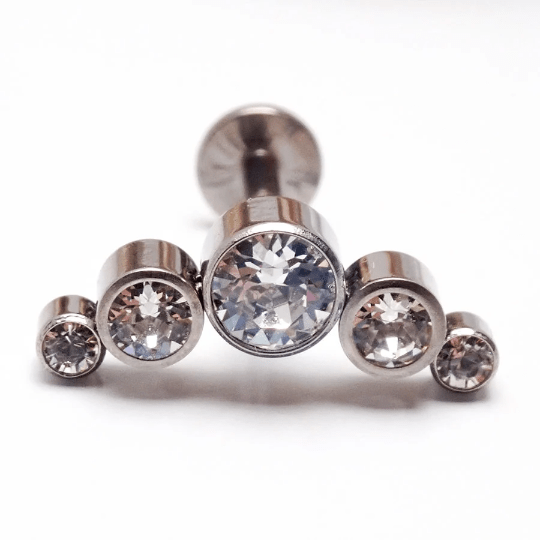 Clear CZ push fit cluster flatback body jewelry in 14g, 16g, 18g, 20g sizes by Body Clickers, featuring sparkling gemstone details.