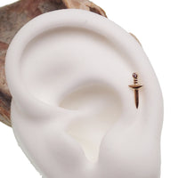 14k gold Dagger body jewelry with flat back in 14g, 16g, 18g, or 20g gauge, featuring a sleek, pointed design from Body Clickers.