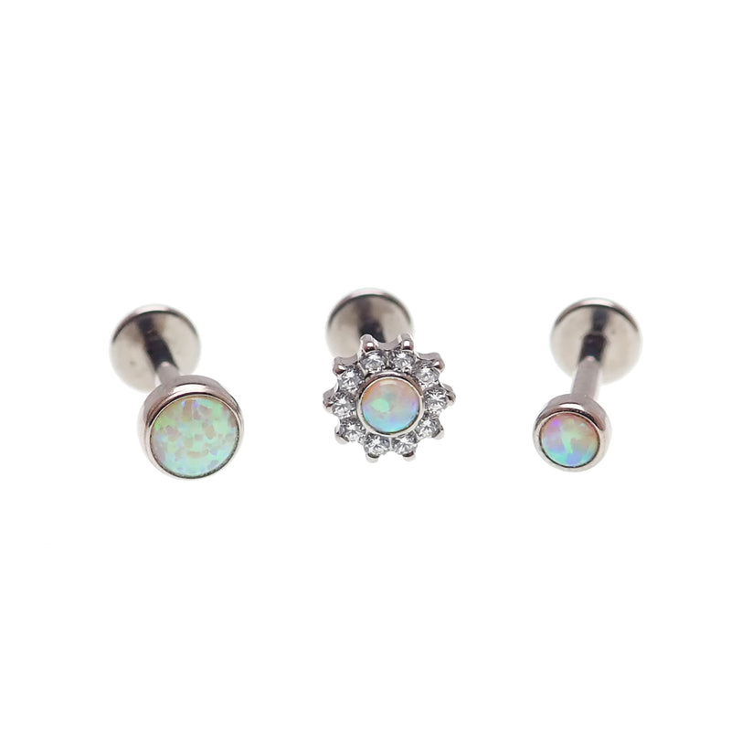 Set of Body Clickers body jewelry featuring opalite peach, CZ flower, and round push-fit designs in 14g, 16g, 18g, and 20g sizes.