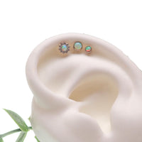 Body Clickers 3-set Opalite Peach and CZ flower and round push fit body jewelry in flatblack, includes 14g, 16g, 18g, and 20g sizes.