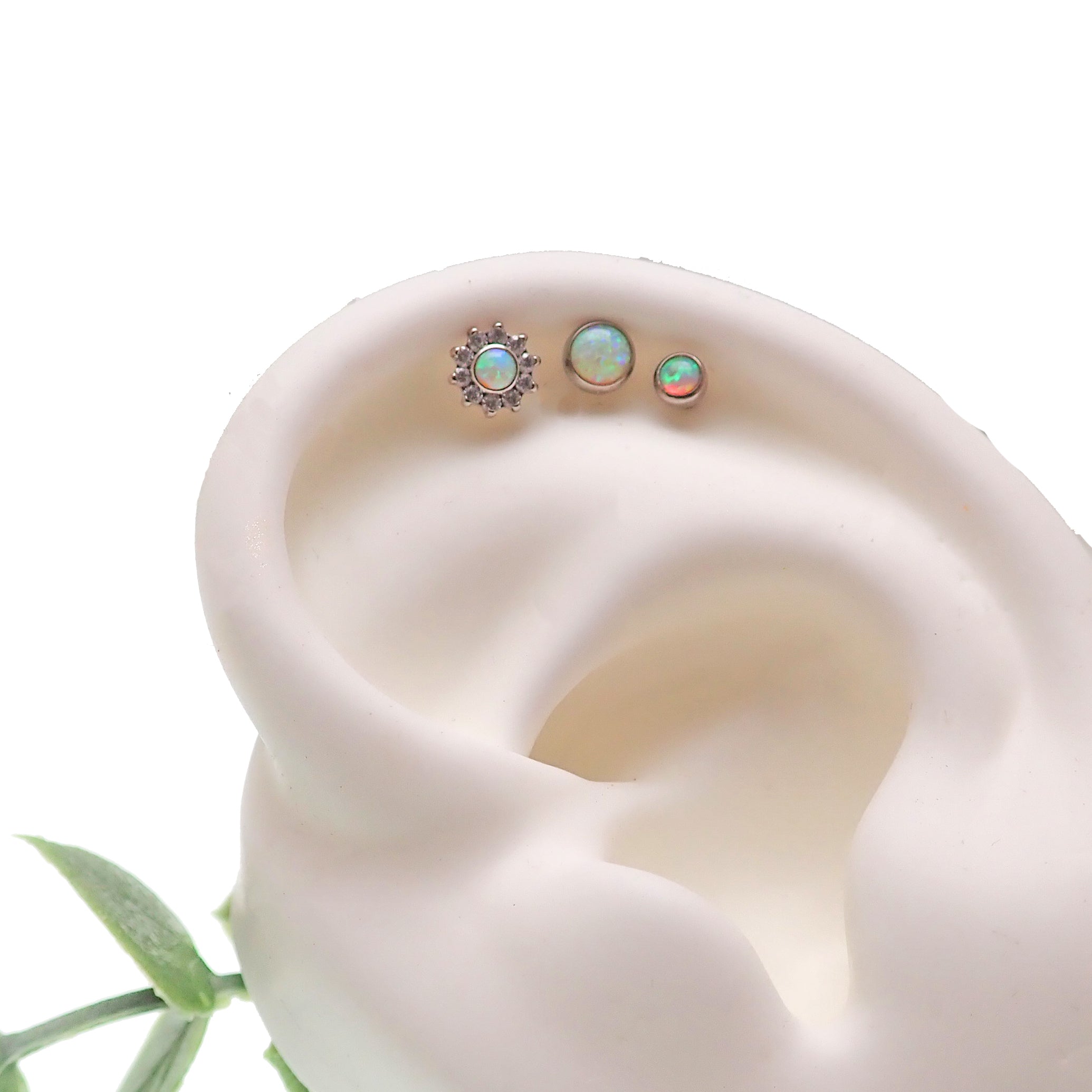 Body Clickers 3-set Opalite Peach and CZ flower and round push fit body jewelry in flatblack, includes 14g, 16g, 18g, and 20g sizes.
