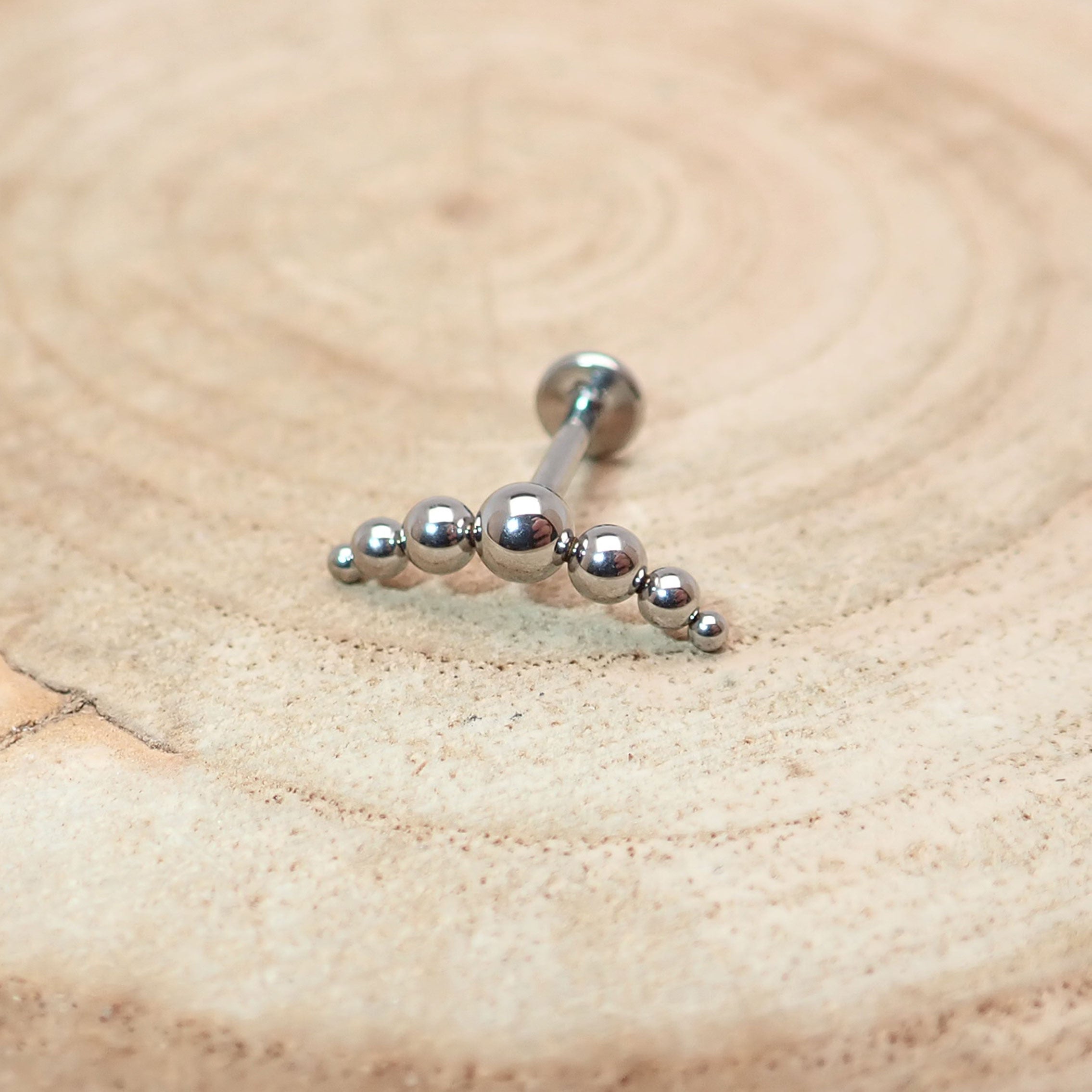 Titanium curved beaded helix cluster body jewelry by Body Clickers, internally threaded, 14 gauge with 6mm beads.