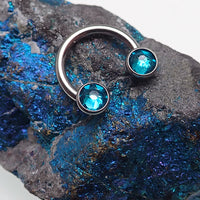 Titanium Zircon blue crystal horseshoe body jewelry in 14g size with 8mm diameter and 3mm zircon stones.