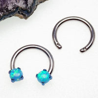 Drilled circular titanium horseshoe body jewelry with 16g top holes, made by Body Clickers, showing the detailed design and craftsmanship.