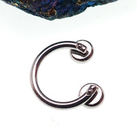 Circular titanium horseshoe body jewelry with 16g top holes, featuring pre-drilled design and polished finish by Body Clickers
