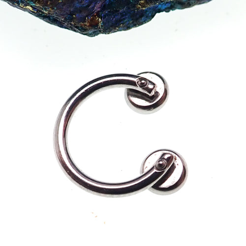 Circular titanium horseshoe body jewelry with 16g top holes, featuring pre-drilled design and polished finish by Body Clickers
