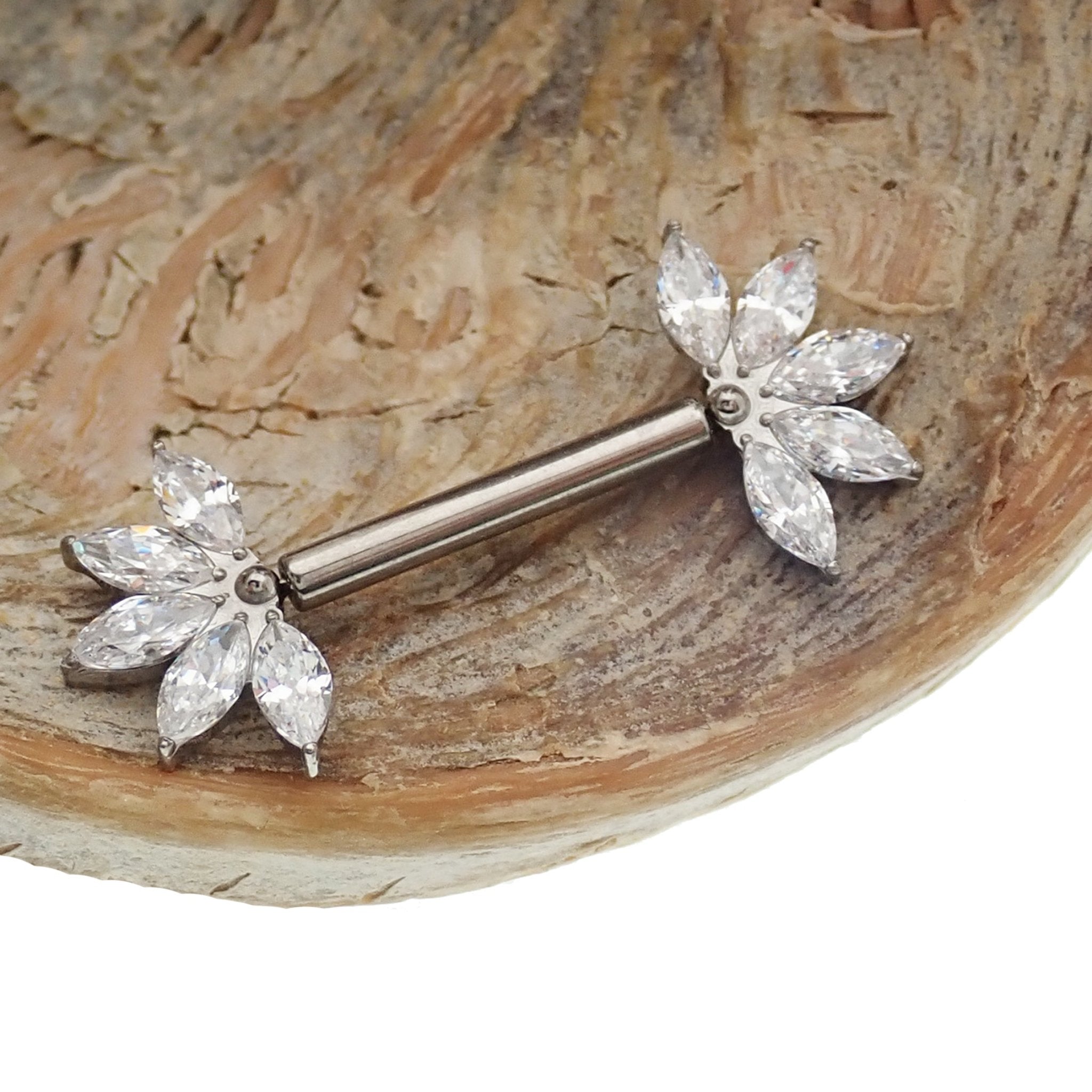Clear CZ flower titanium nipple barbell in 16g and 14g with flower design, Body Clickers body jewelry for pierced nipples.