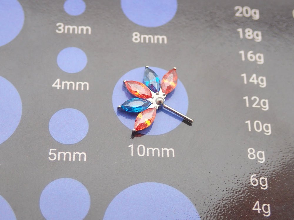 Orange and blue CZ flower titanium nipple bar in 12g, 14g, 16g body jewelry by Body Clickers, featuring colorful floral design.