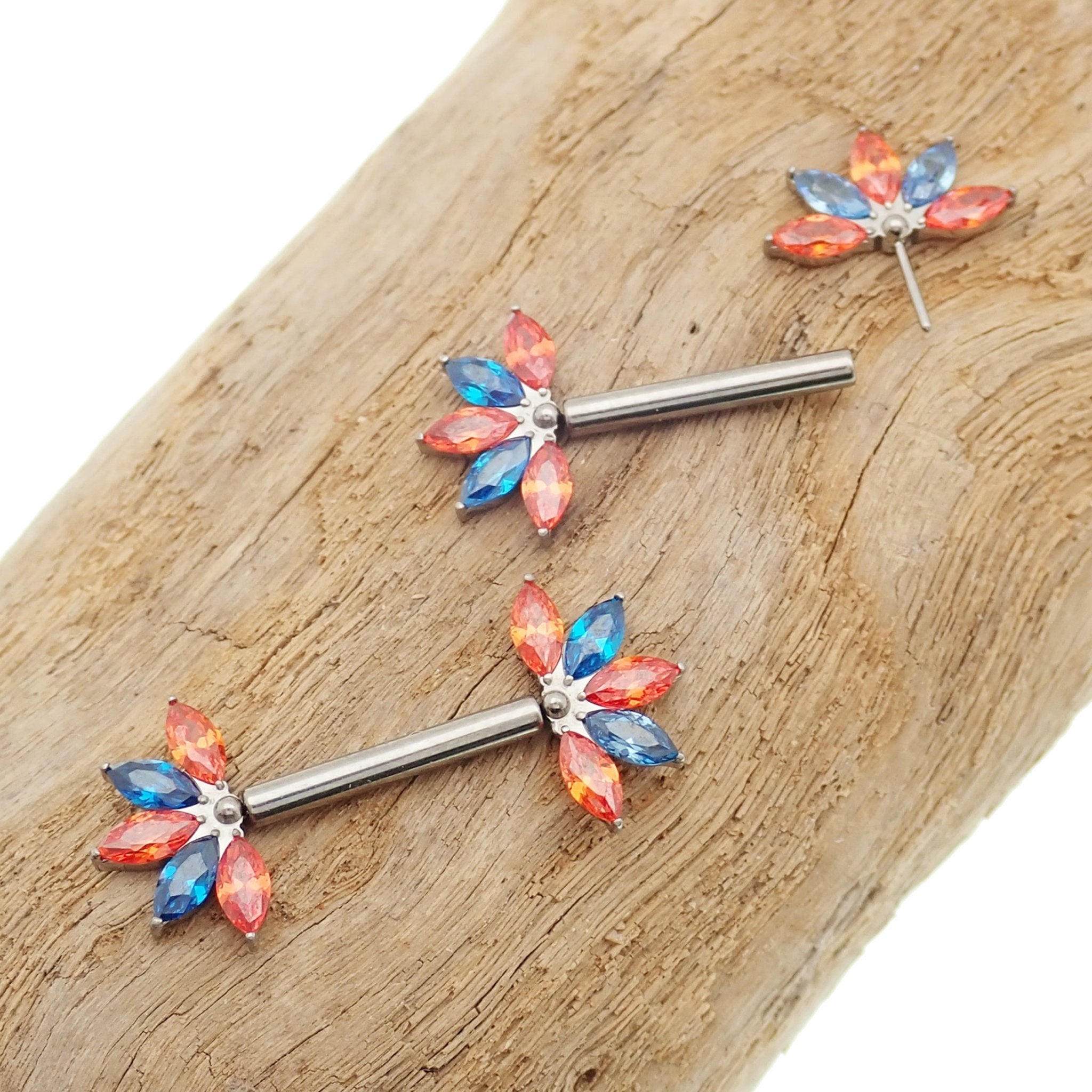 Orange and blue CZ flower titanium nipple bar in 12G, 14G, 16G gauges, body jewelry by Body Clickers with 12mm length.
