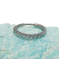 Titanium CZ clicker hoop body jewelry in 16g, 18g, 20g with a 6mm diameter, featuring sparkling cubic zirconia accents.