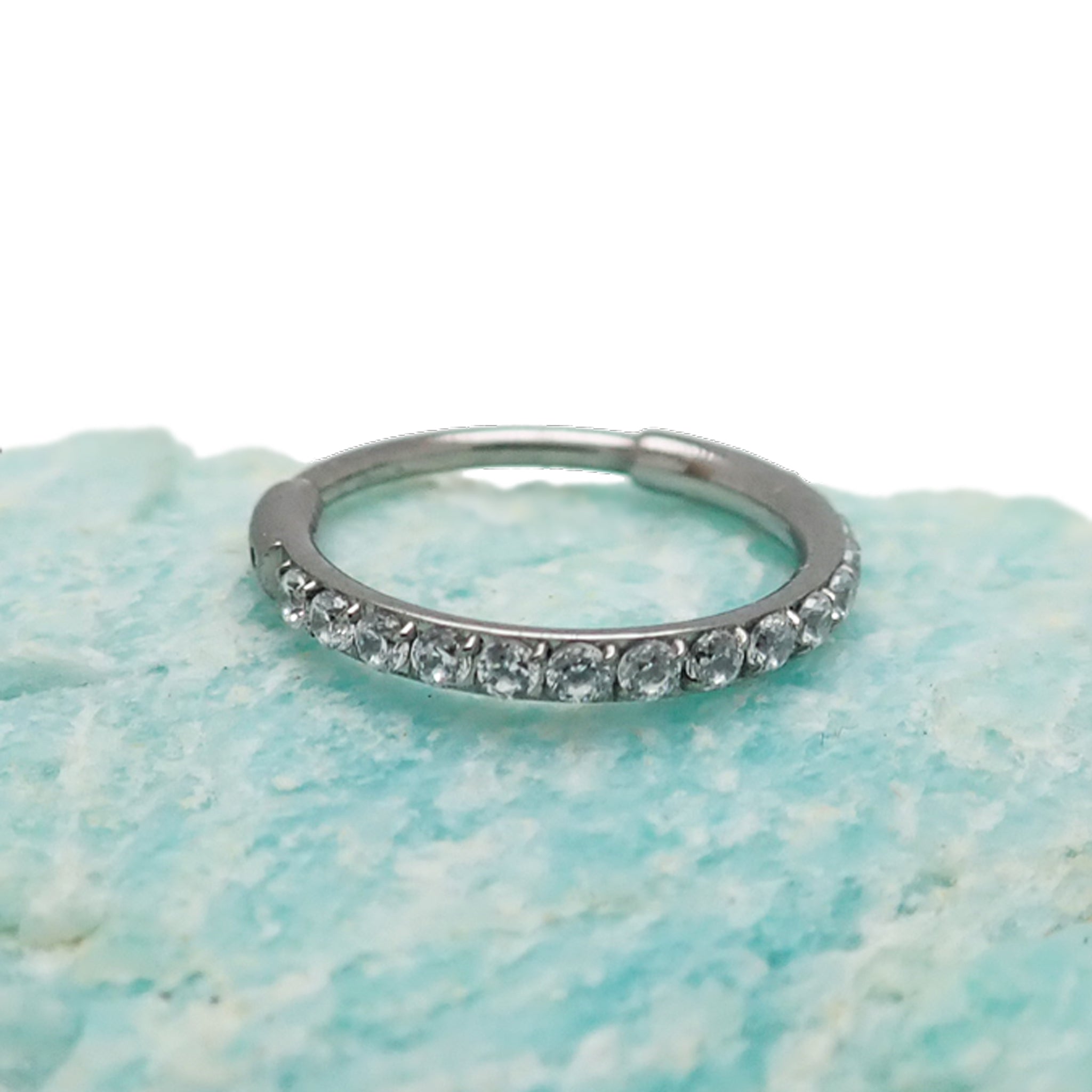Titanium CZ clicker hoop body jewelry in 16g, 18g, 20g with a 6mm diameter, featuring sparkling cubic zirconia accents.