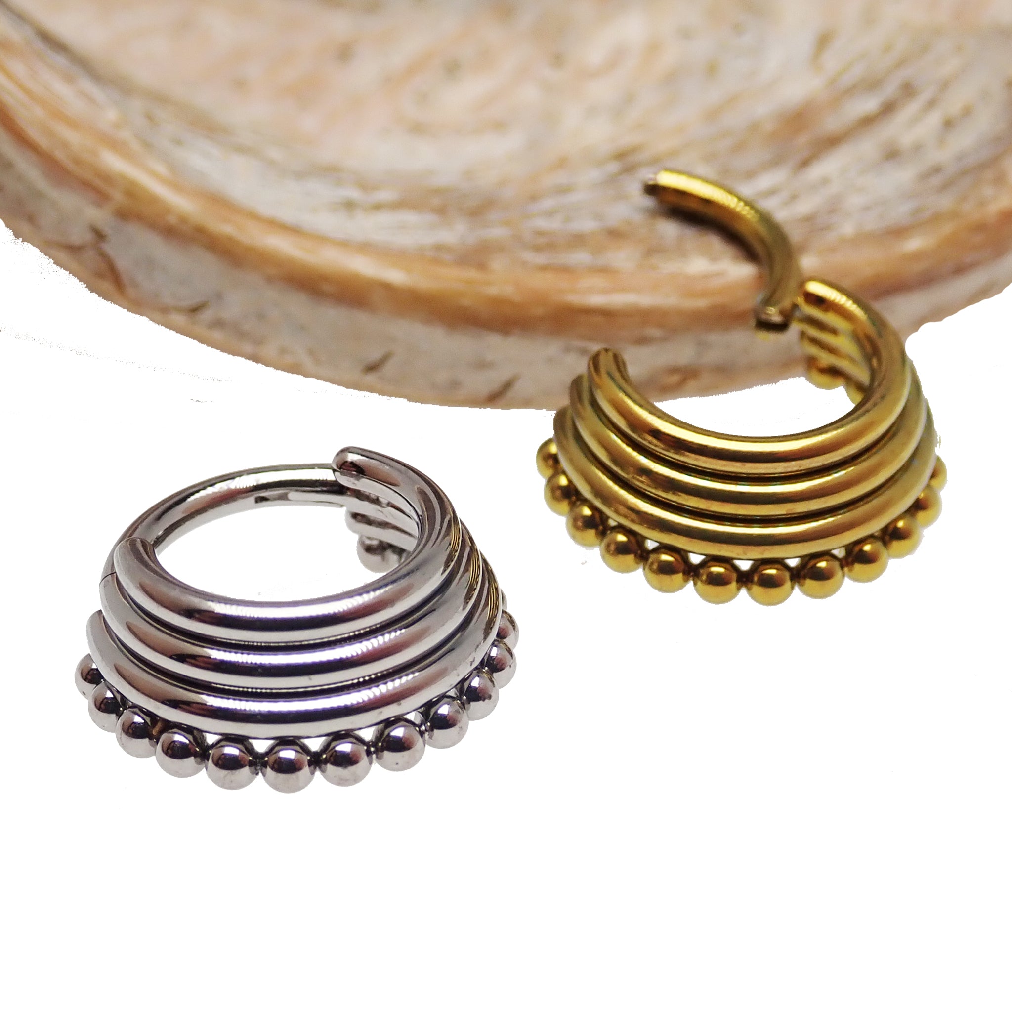 Body Clickers 3-tier stacked beaded body jewelry in 16g and 14g with gold-tone beads and curved design for piercings.
