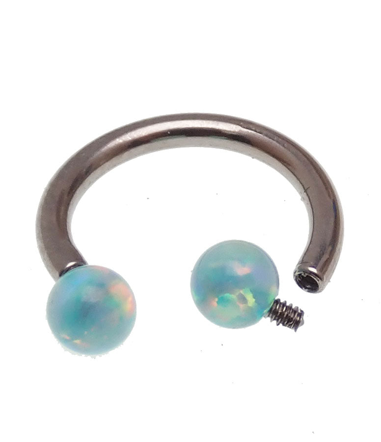 Body Clickers horseshoe body jewelry with 16g and 18g yellow opal ends, featuring moon-shaped design in gold-tone finish.
