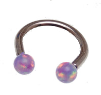 Body Clickers Opal Ends Horseshoe body jewelry in 16g and 18g with yellow opal accents and moon design.