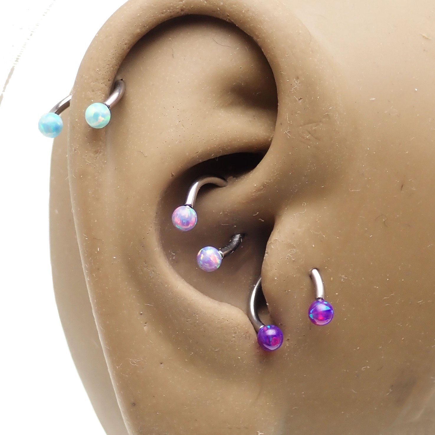 Body Clickers opal ends horseshoe body jewelry in 16g and 18g with yellow opal accents and moon design, suitable for body piercing.