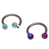 Body Clickers horseshoe body jewelry with yellow opal ends in 16g and 18g, featuring moon-shaped accents and sleek design.