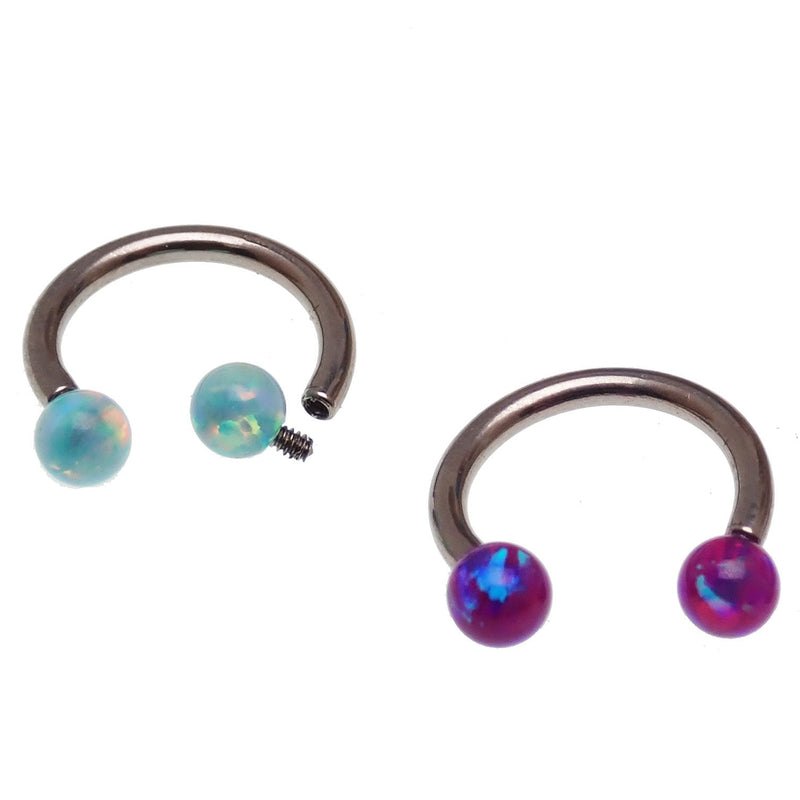 Body Clickers horseshoe body jewelry with yellow opal ends in 16g and 18g, featuring moon-shaped accents and sleek design.