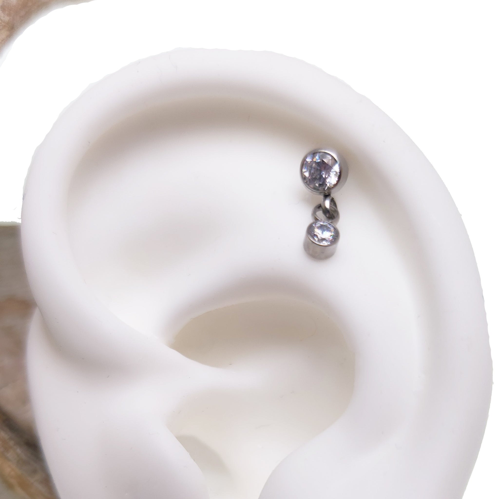 Clear CZ dangle flat back body jewelry in 14g, 16g, and 18g from Body Clickers, featuring sparkling cubic zirconia stones.
