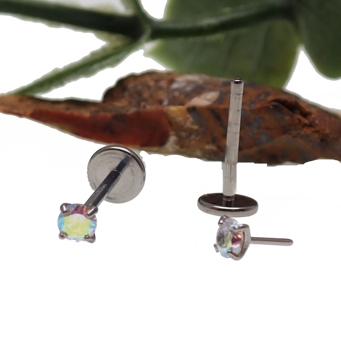 Rainbow AB push fit titanium flatback body jewelry in 16g and 18g, featuring colorful design and secure fit by Body Clickers.