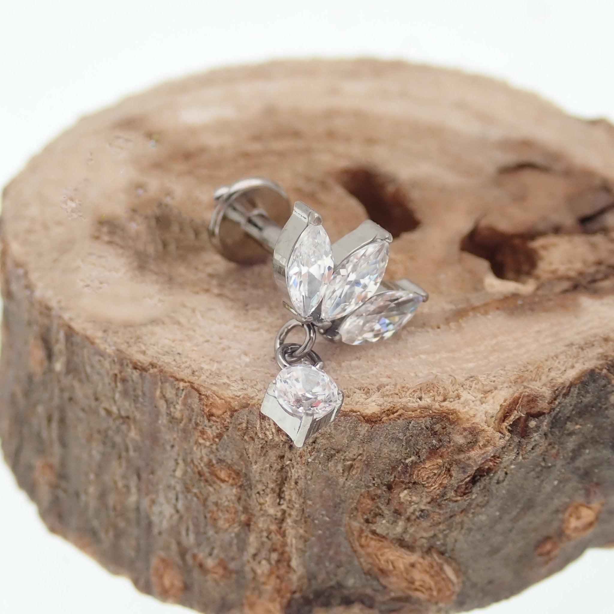 Small flower dangle body jewelry by Body Clickers, titanium flatback design in 14g, 16g, and 18g gauges with 6mm flower detail.