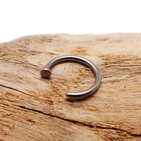 Titanium nose hoop body jewelry in 8mm and 10mm sizes, 18g and 20g gauges, from Body Clickers, showing a sleek piercing accessory.