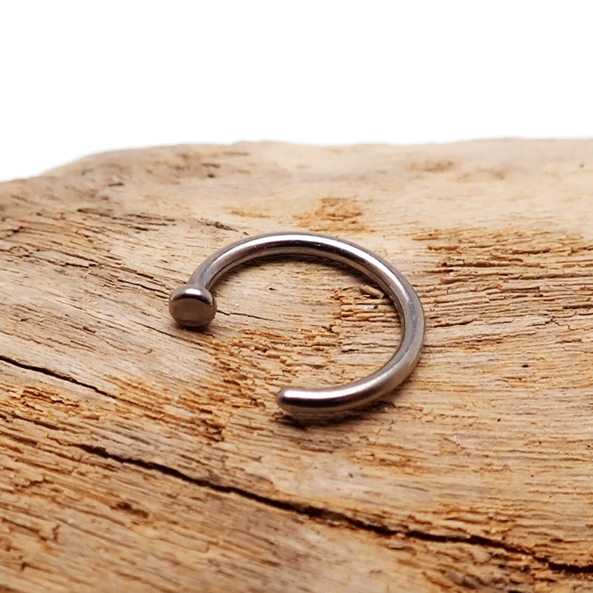 Titanium nose hoop body jewelry in 8mm and 10mm sizes, 18g and 20g gauges, from Body Clickers, showing a sleek piercing accessory.