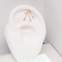 14k gold dangle body jewelry by Body Clickers in 20g, 18g, 16g, 14g sizes with push-fit flatback design.