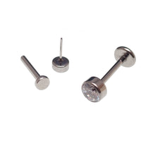 Clear CZ titanium push fit flat back body jewelry in 14g, 16g, 18g, or 20g with 6mm diameter and 2mm thickness.