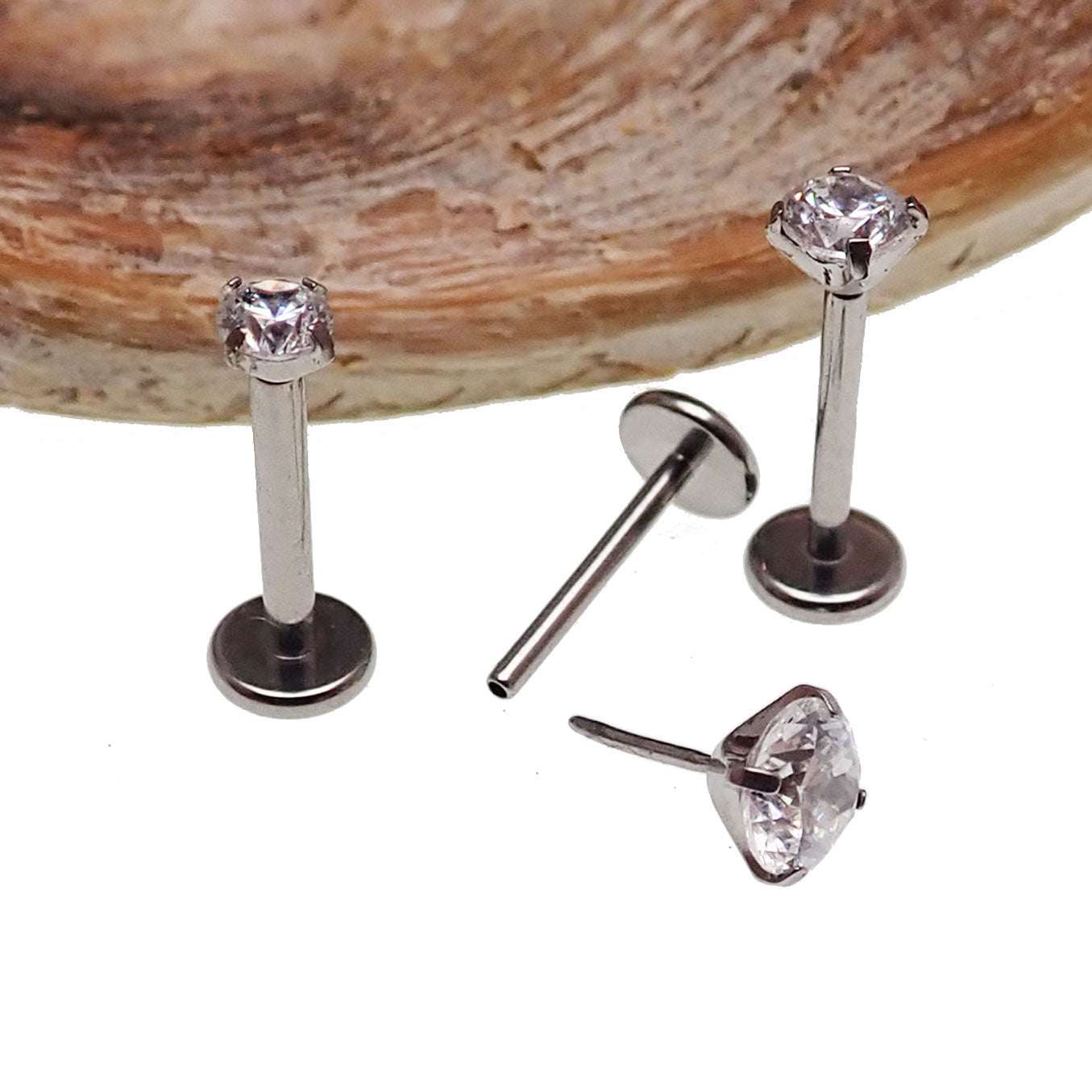 Push Fit Crystal flat back labret body jewelry by Body Clickers, available in 3, 4, and 5mm with clear crystal accents.