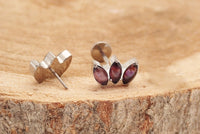 Amethyst Lotus push fit flatback titanium body jewelry in 14g to 20g sizes, featuring a lotus design and secure fit.