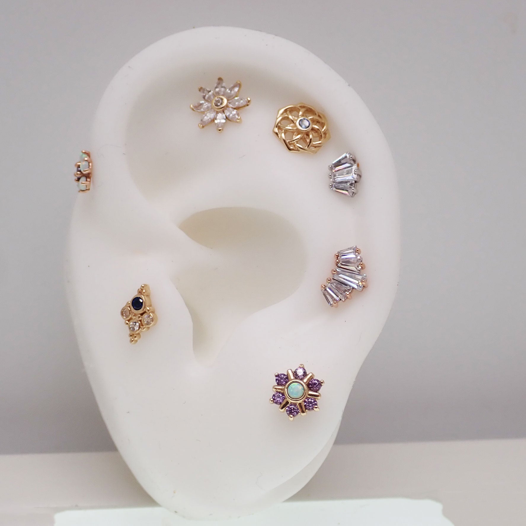 14k gold Marquise 3-stone body jewelry by Body Clickers, 20g push fit design with 6mm stones in a sleek body jewelry setting.