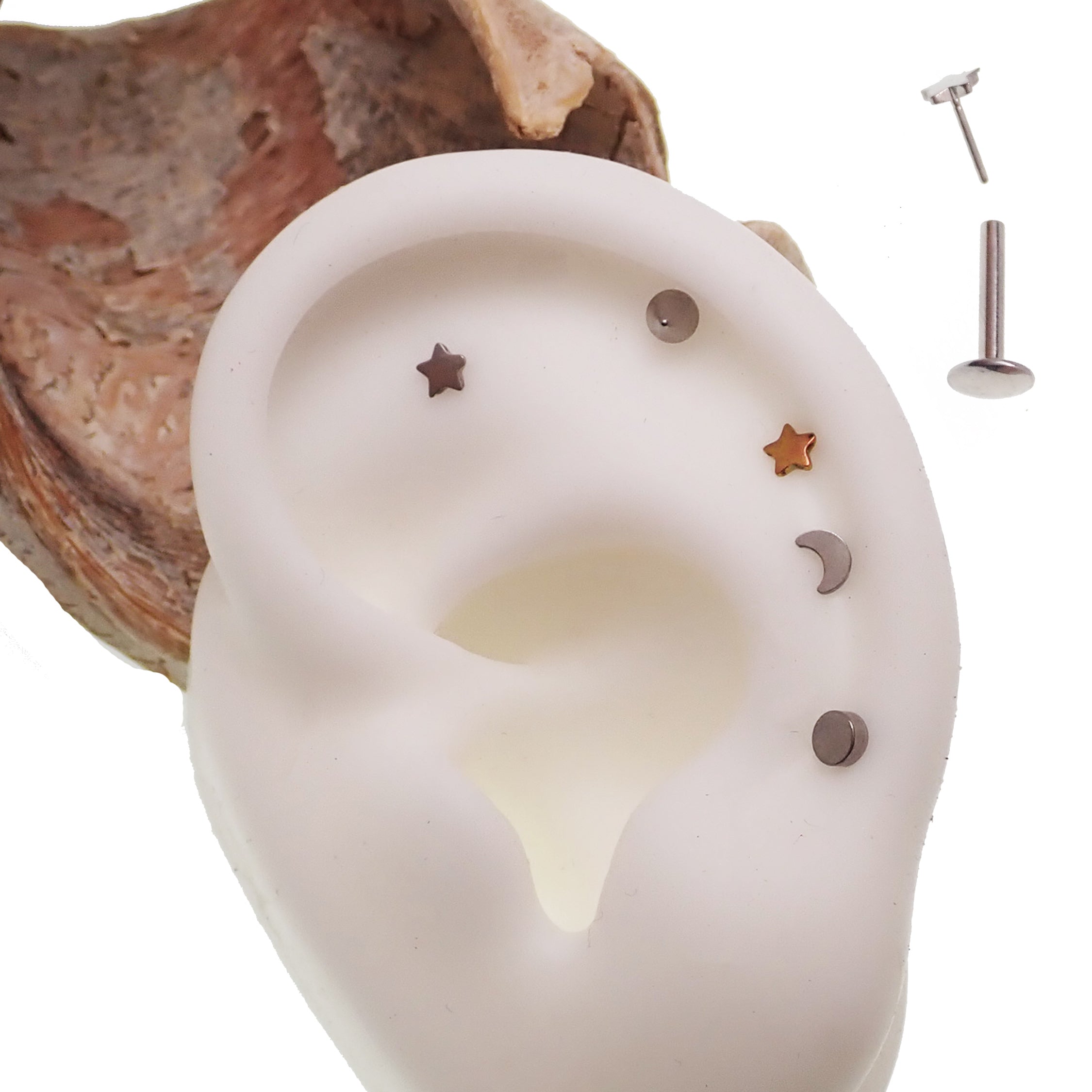 Titanium push fit shapes flat back body jewelry in 20g, 18g, 16g, 14g with star design from Body Clickers