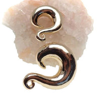 Gold-dipped curvy brass plugs in 2g, 0g, 00g, 1/2" size, Body Clickers body jewelry, with sleek, polished design.