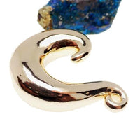 Gold-dipped brass body jewelry plugs in 2g, 0g, 00g, 1/2 inch, featuring a curvy design from Body Clickers.