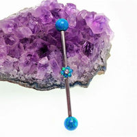 Peacock blue opal industrial barbell body jewelry in 14g with stainless steel construction and decorative gemstone design.