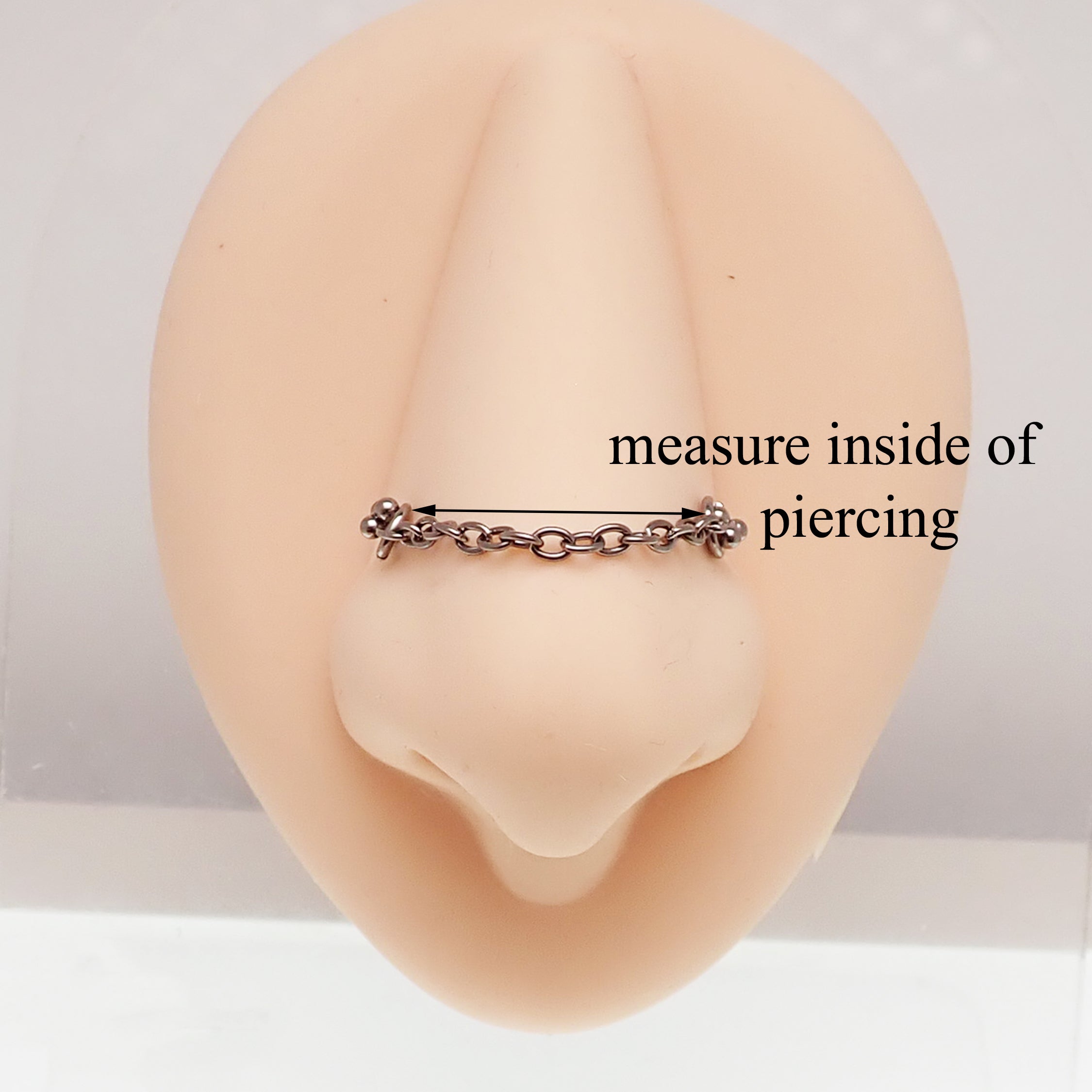 Titanium chain body jewelry by Body Clickers for various piercings, featuring a sleek 32mm design and durable titanium material.