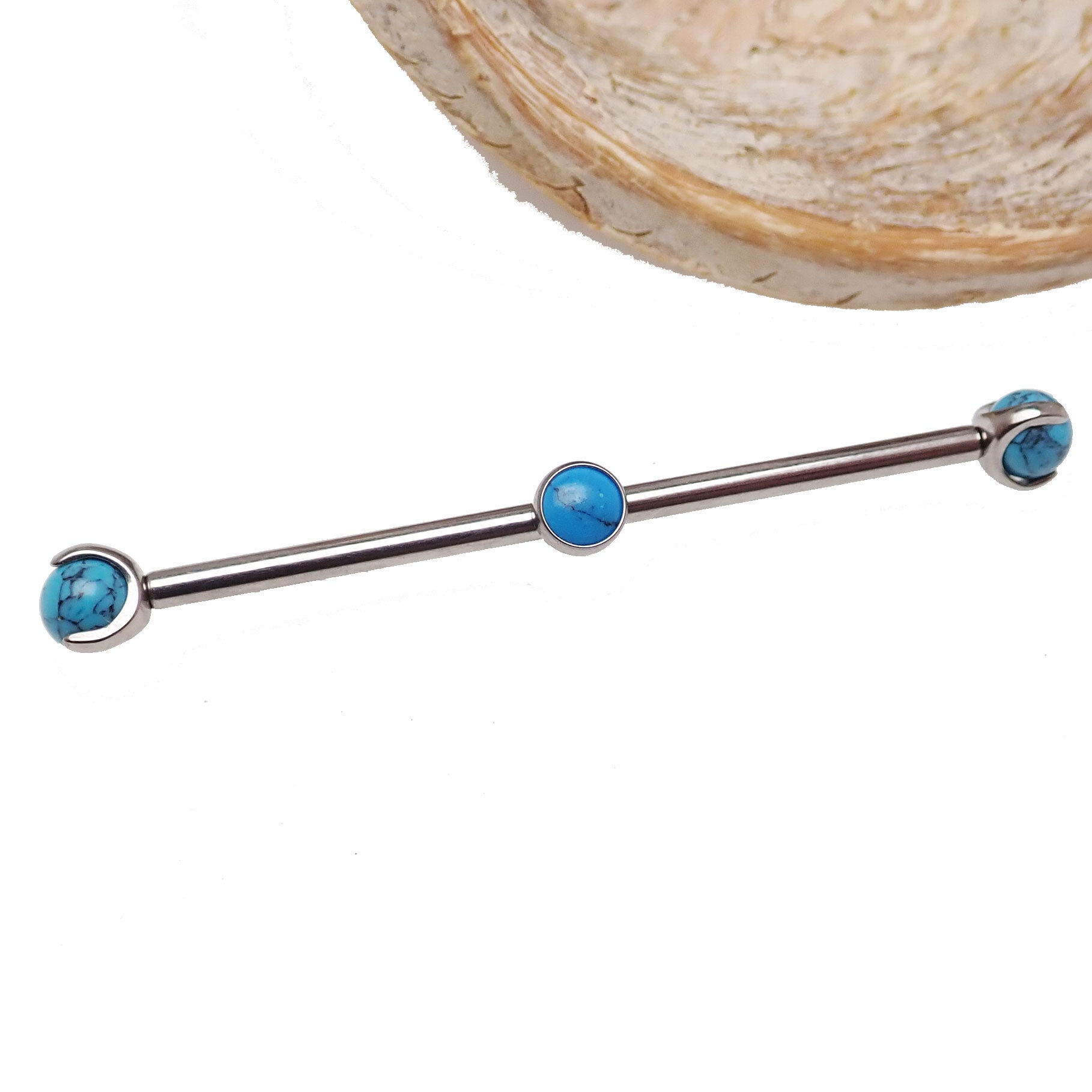 Turquoise titanium industrial barbell for body piercing, 14g, from Body Clickers, with a 32mm length and smooth finish.