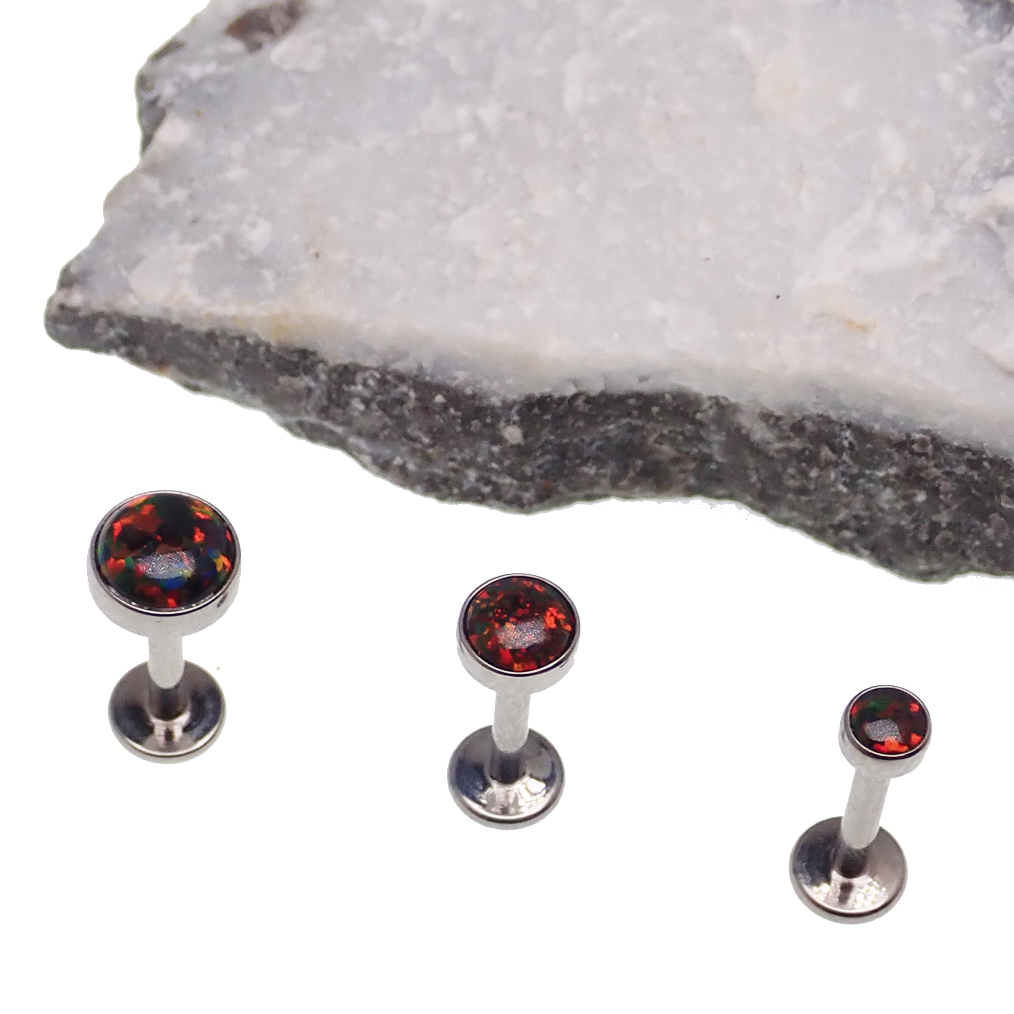 Black cherry opal flat back body jewelry piercing in 14g, 16g, or 18g by Body Clickers, shown with the gemstone and metal setting.