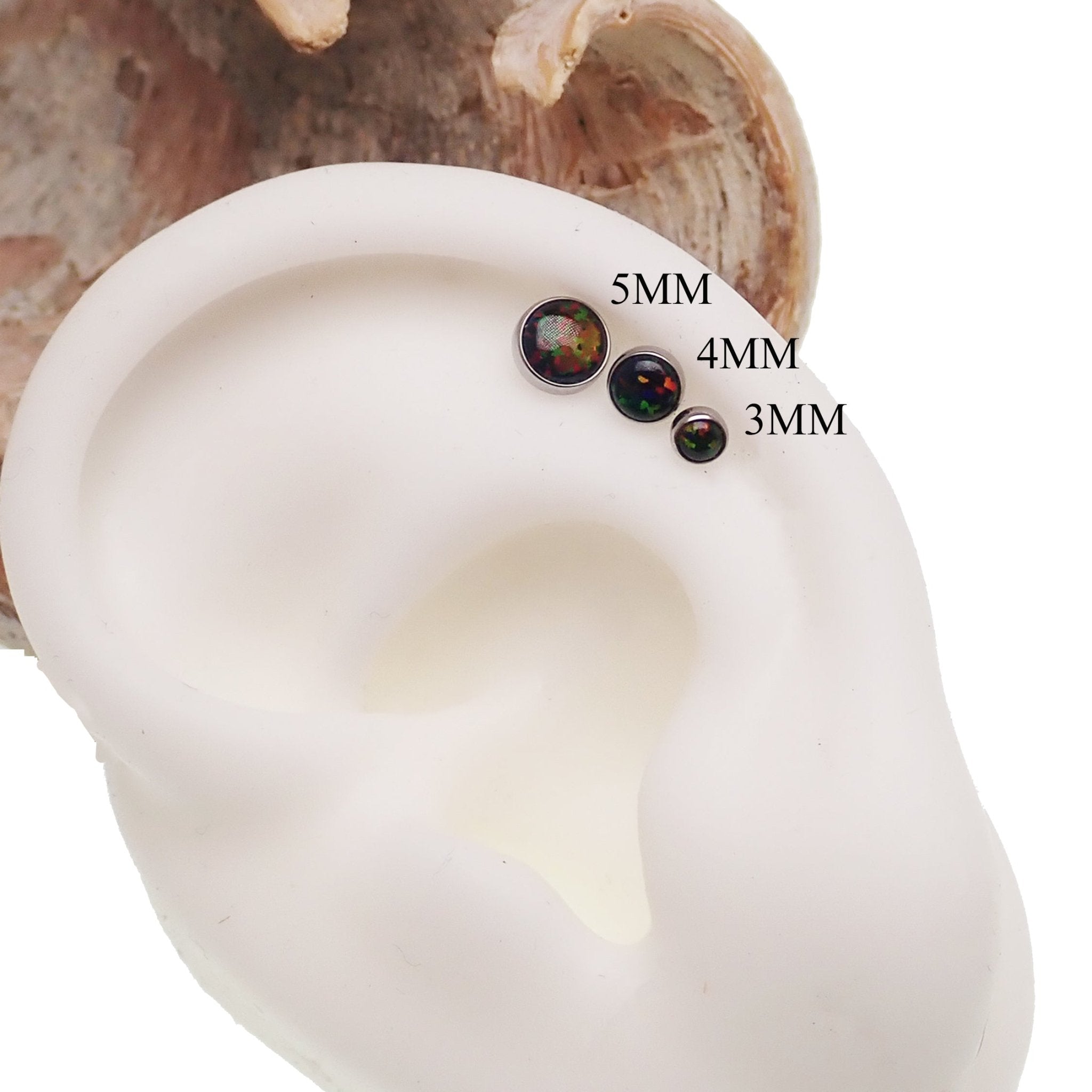 Black Opal titanium flatback piercing by Body Clickers, internally threaded body jewelry in 18g with 3mm and 6mm sizes.