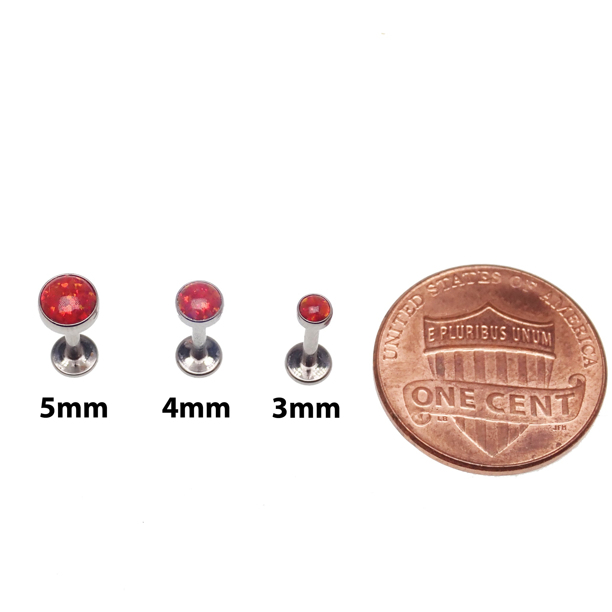 Fire opal flat back body piercing in 14g, 16g, or 18g from Body Clickers, shown on a model with clear skin.
