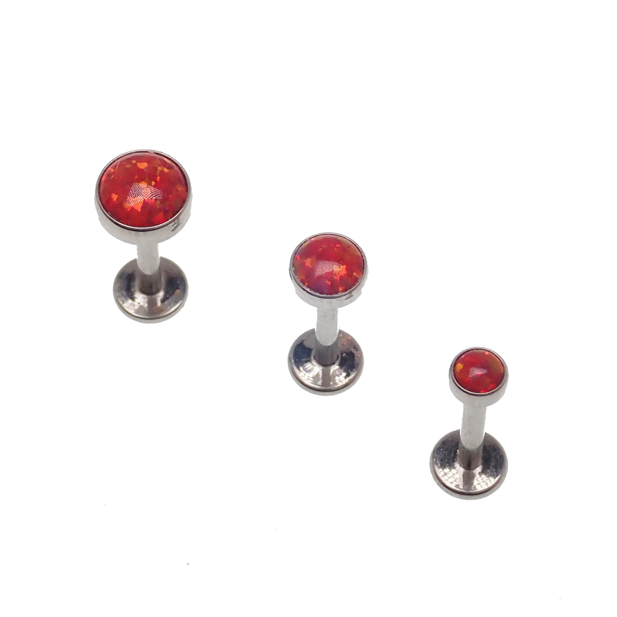 Fire Opal flat back body jewelry piercing by Body Clickers, available in 14g, 16g, and 18g with 3mm or 6mm sizes.