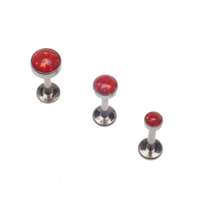 Fire Opal flat back body jewelry piercing by Body Clickers, available in 14g, 16g, and 18g with 3mm or 6mm sizes.